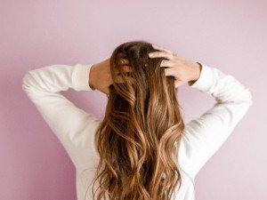 Girl in white shirt and pink background