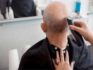 man shaving head