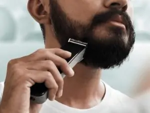 man shaving beard