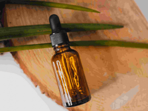 bottle of essential oil on a tree trunk