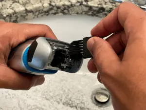 man brushing nd cleaning a razor