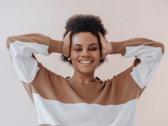 woman smiling wearing sweatshirt