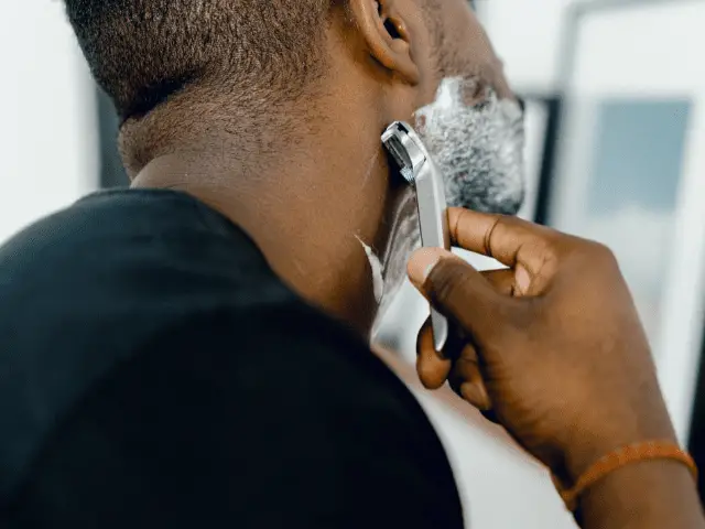 black man shaving beard
