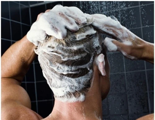 Man shampooing