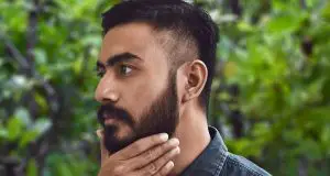 Man feeling beard