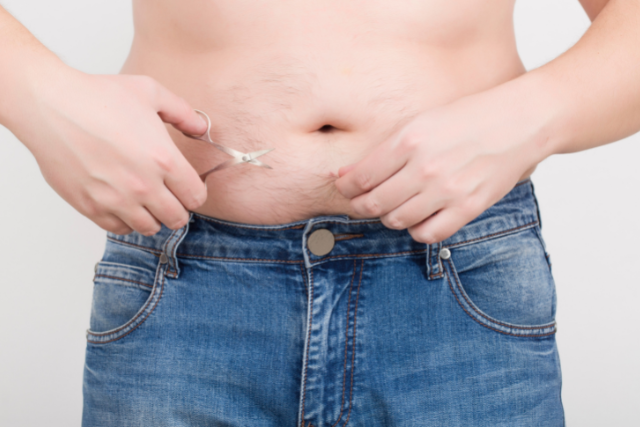 trimming body hair with scissor