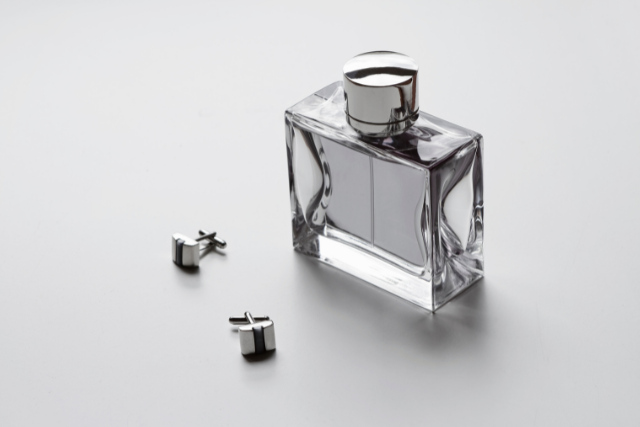 bottle of cologne and cufflinks - featured image